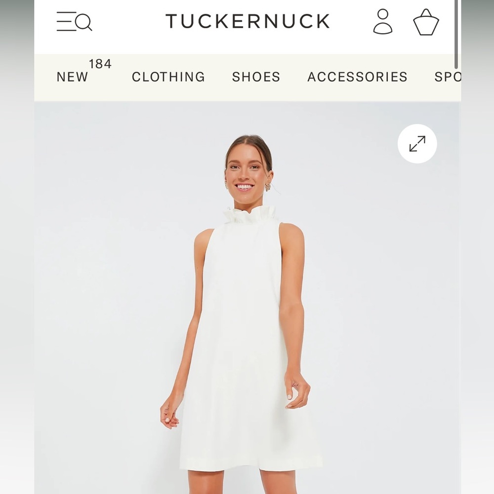 White dress with high neck and bow